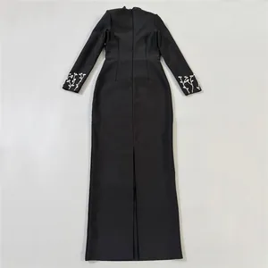 Detailed rear view of black long sleeve bandage maxi dress with elegant embroidered cuffs