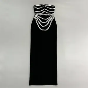 Elegant black strapless bandage maxi dress featuring intricate rhinestone chain detailing