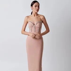Elegant strapless pink bandage midi dress featuring sparkling crystal corset embellishments