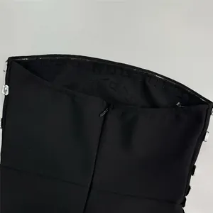 Close-up detail of back invisible zipper and rhinestones on black bandage dress detail