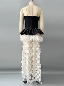 Elegant strapless contrast evening dress with ruffled peplum and sheer sequin skirt