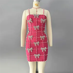 Elegant hot pink bandage bodycon mini dress with pearl grid and rhinestone bow details