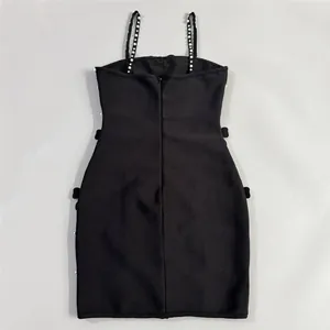 Detailed back view of a black bandage mini dress with pearl-beaded straps.