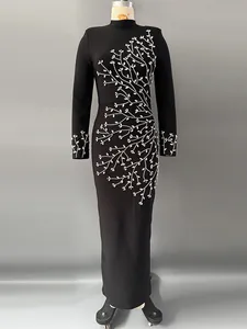Elegant black long-sleeve bandage maxi dress featuring a sparkling silver rhinestone branch motif