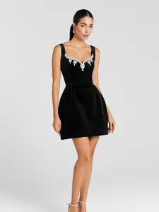 Elegant black sleeveless bandage mini dress with crystal embellishments for evening parties