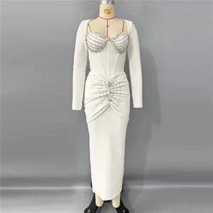 Full view of elegant white long sleeve bandage dress featuring heavy rhinestone embellishments