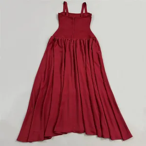 Detailed view of the back of a red bandage maxi dress with elegant gathered skirt
