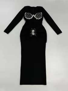 Elegant long-sleeved black bandage dress featuring heavy rhinestone crystal embellishments