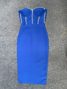 Detailed view of royal blue bandage dress with elegant rhinestone embellishments