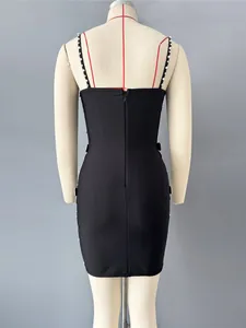 Elegant black bandage mini dress featuring pearl bead straps and side bow details