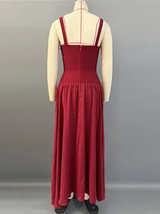 Elegant red bandage evening gown with spaghetti straps and a flowing long skirt