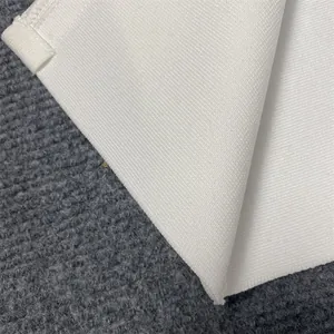 Close-up detail of white elastic bandage fabric showing high-density ribbed texture quality.