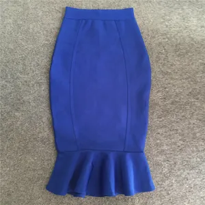 Close-up detail showing the royal blue mermaid bandage skirt with a flared ruffle hem