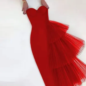 Close-up of an elegant red strapless bodycon dress featuring layered mesh ruffle details