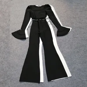 Chic black and white two-piece bandage set with long-sleeved crop top and flared pants