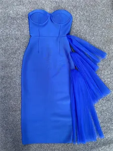 Royal blue strapless bodycon dress featuring elegant side tiered tulle ruffles.