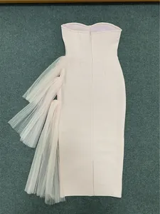 Elegant pink strapless bandage dress with tiered tulle mesh ruffles for parties.