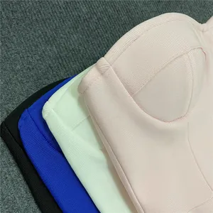 Close-up of French-style bandage dress bustiers in pink, white, blue, and black colors.
