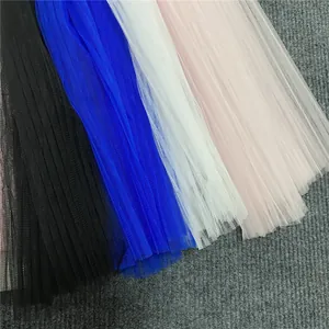 Macro detail of multi-colored pleated mesh tulle fabric for evening dress designs