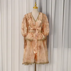Detailed view of the French court style V-neck printed dress with elegant lace trim.