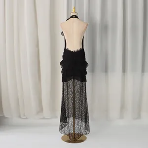 Back view of black lace halter dress featuring an elegant open back and ruffled fishtail hem