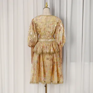 Detail view of a French court style floral midi dress with bubble sleeves and lace trim.