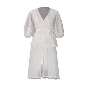 Elegant white French palace style V-neck dress with puff sleeves and lace detailing.