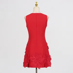 Back view of red sleeveless mini dress featuring intricate 3D floral hemline detail