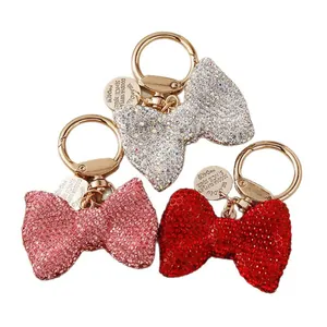 Sparkling rhinestone bow keychains in silver pink and red for stylish car key decor