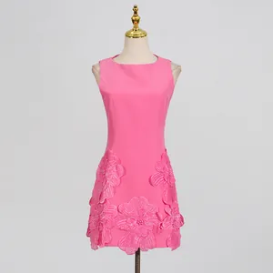 Close-up of pink French style sleeveless dress with 3D floral appliqués and beads