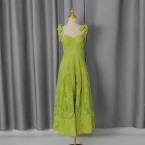 Full detail view of lime green embroidered spaghetti strap midi dress on mannequin