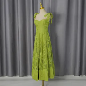 Front view of lime green embroidered maxi dress with tie shoulder straps on mannequin