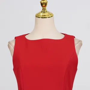 Detailed macro shot of the round neckline on this French style red sleeveless dress.