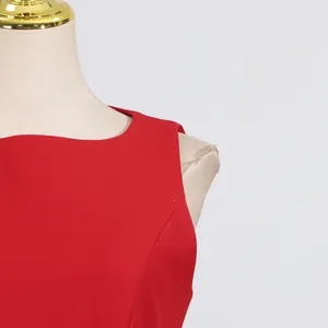 Detail shot of a vibrant red sleeveless round neck French style sweet summer dress