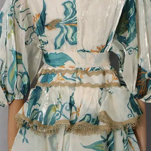 Close-up of French court style floral midi dress with intricate gold lace detailing.