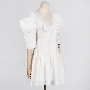View of the white French court style dress's elegant V-neck and ruffled puff sleeves