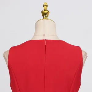 Detailed view showing the back invisible zipper and round neckline of a red dress