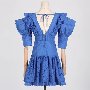 Back detail of blue French style puff sleeve dress with embroidery and deep V-neck