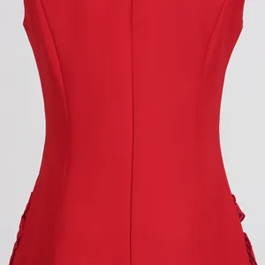 Macro shot of a red sleeveless dress waist featuring 3D floral ruffles and a smooth texture.
