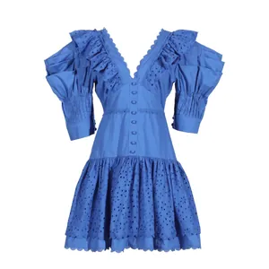 Detailed view of the blue French style eyelet dress featuring elegant ruffles and V-neckline