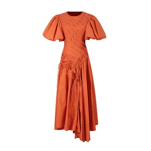 Elegant orange French style maxi dress featuring an irregular hem and pleated puff sleeves.