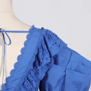 Detailed view of a blue French style dress featuring elegant eyelet lace ruffle shoulder