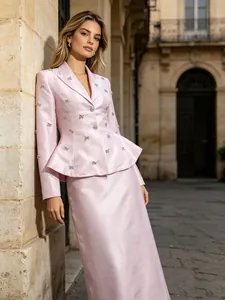 Elegant pink satin suit set with rhinestone blazer and skirt for socialite style.