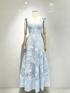 Sweet light blue floral embroidered maxi dress with spaghetti straps and bow details