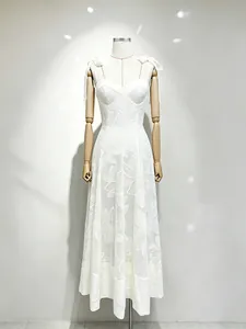 Elegant white embroidered spaghetti strap maxi dress with waist-slimming fit for summer