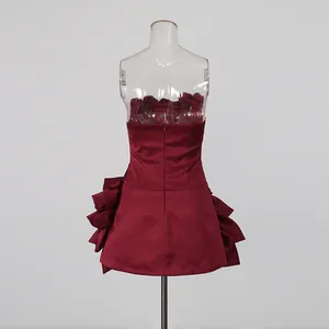 Elegant back view of wine red strapless mini dress featuring decorative 3D petal side accents