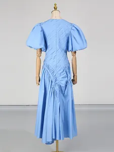 Elegant French style blue pleated maxi dress featuring puff sleeves and irregular hem design