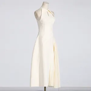 Side view of white sleeveless pleated dress with hollow out chest and elegant collar detail