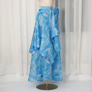 Close-up view of the elegant blue abstract print irregular layered maxi skirt on display