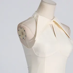 Detail view of French palace style sleeveless dress with unique lapel and hollow-out design